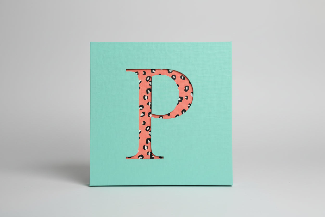 Wooden initial wall art with fabric